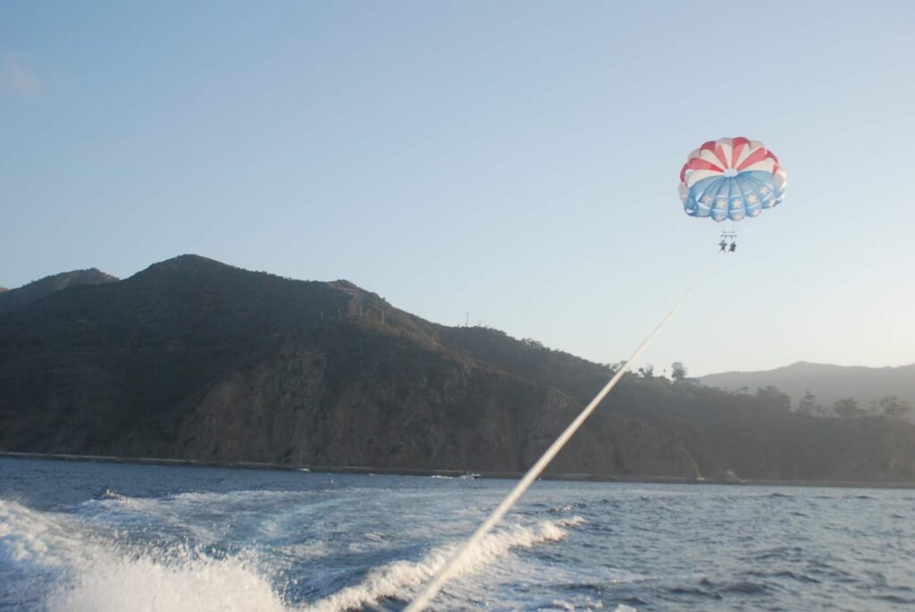 Parasailing and pulled by a motorboat