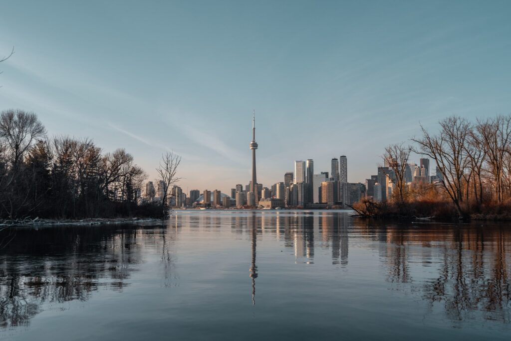 body of water near city buildings during daytime