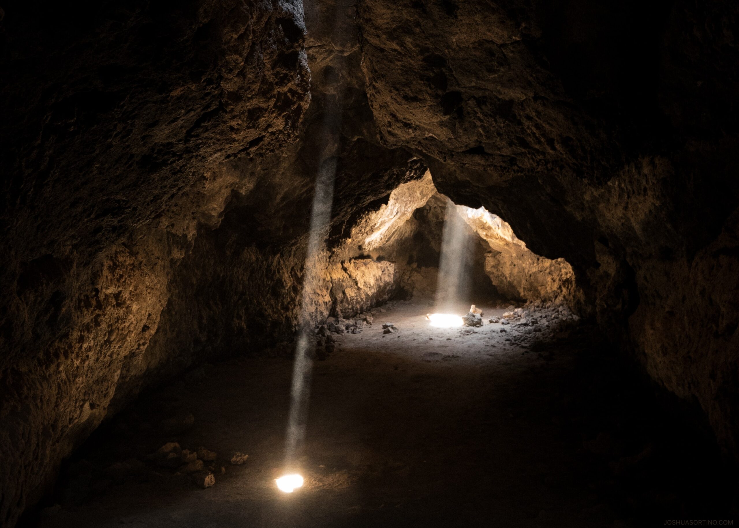 photo of light towards inside of cave. The best Lava Cave In Flagstaff, Arizona