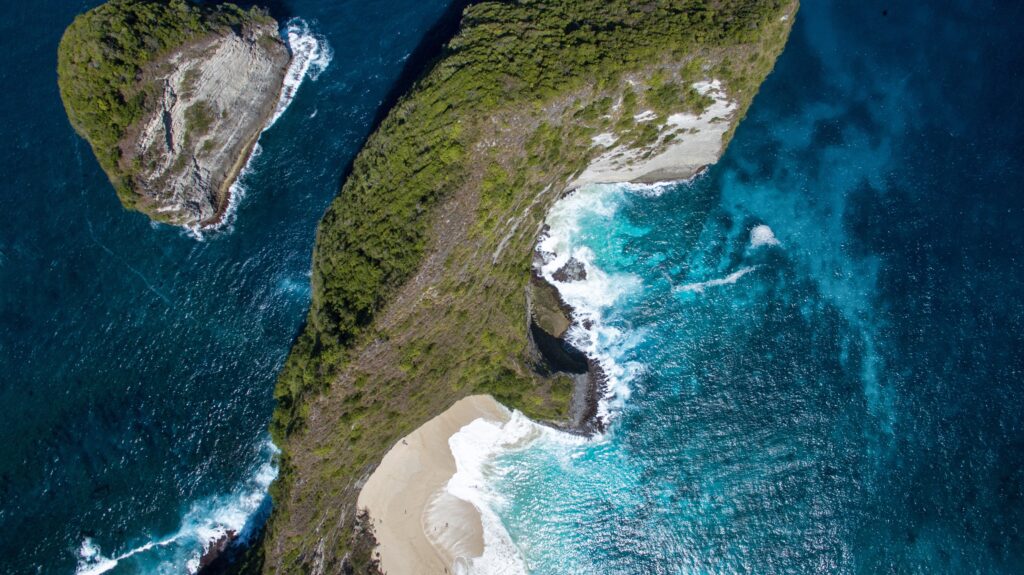 aerial photo of island on sea