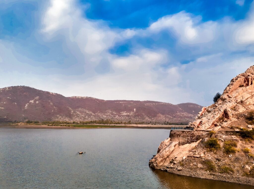 a body of water with a mountain in the background