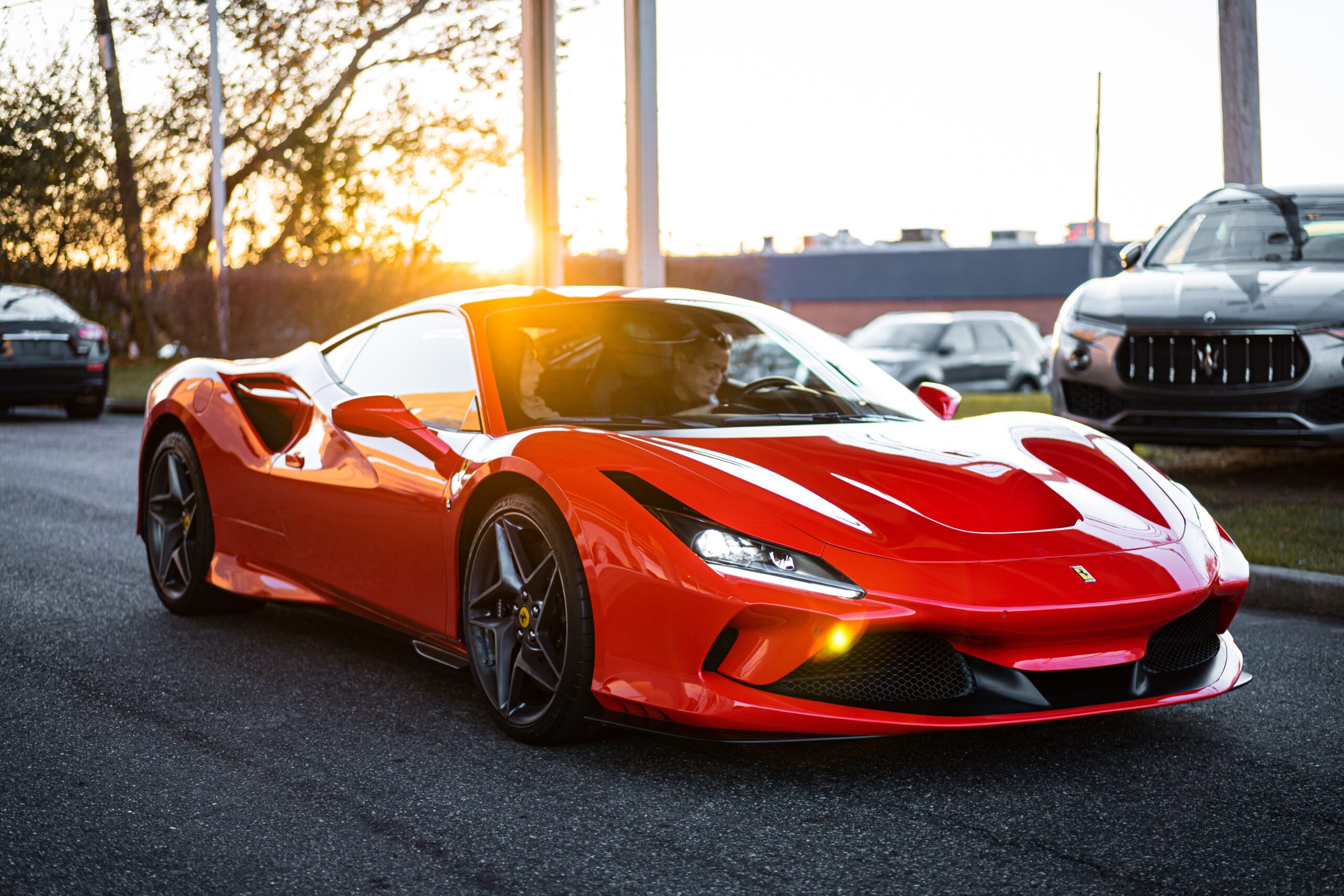 red ferrari 458 italia on road during daytime. Ferrari Rental Guide